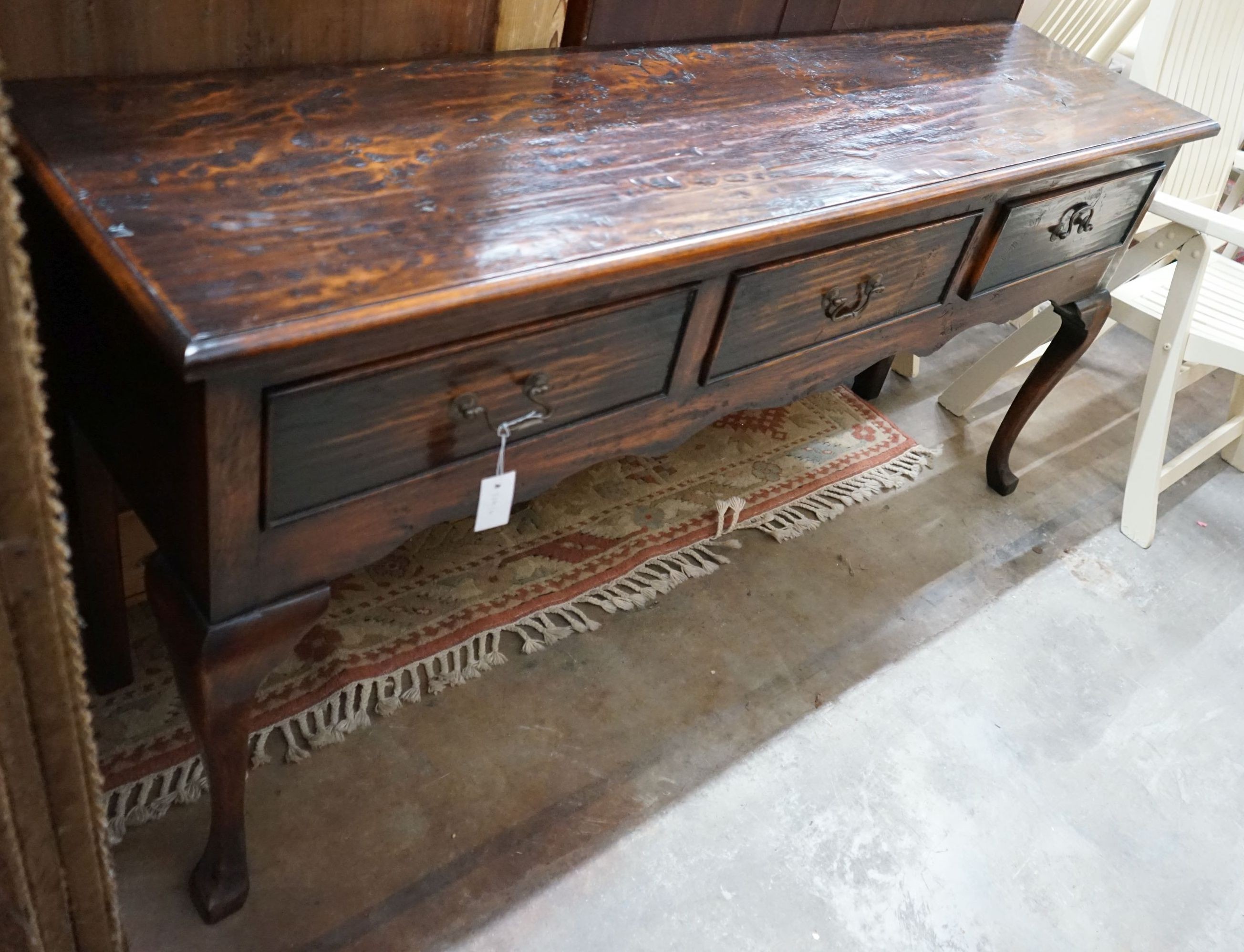 A reproduction 18th century style oak low dresser, length 170cm, depth 43cm, height 81cm